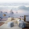 Papier peint panoramique de montagnes brumeuses et lac dans un salon beige