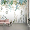 Papier peint panoramique feuillage aquarelle vert et colibris dans un salon au canapé rose