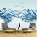 Papier peint panoramique montagnes bleues à l'encre avec soleil rouge et cerfs, salon