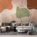 Papier peint panoramique feuillages tropicaux au trait, tons terracotta et vert sauge, salon