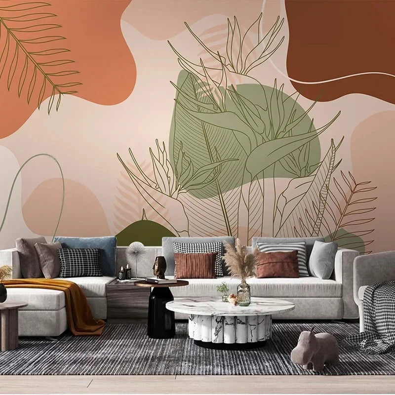 Papier peint panoramique feuillages tropicaux au trait, tons terracotta et vert sauge, salon