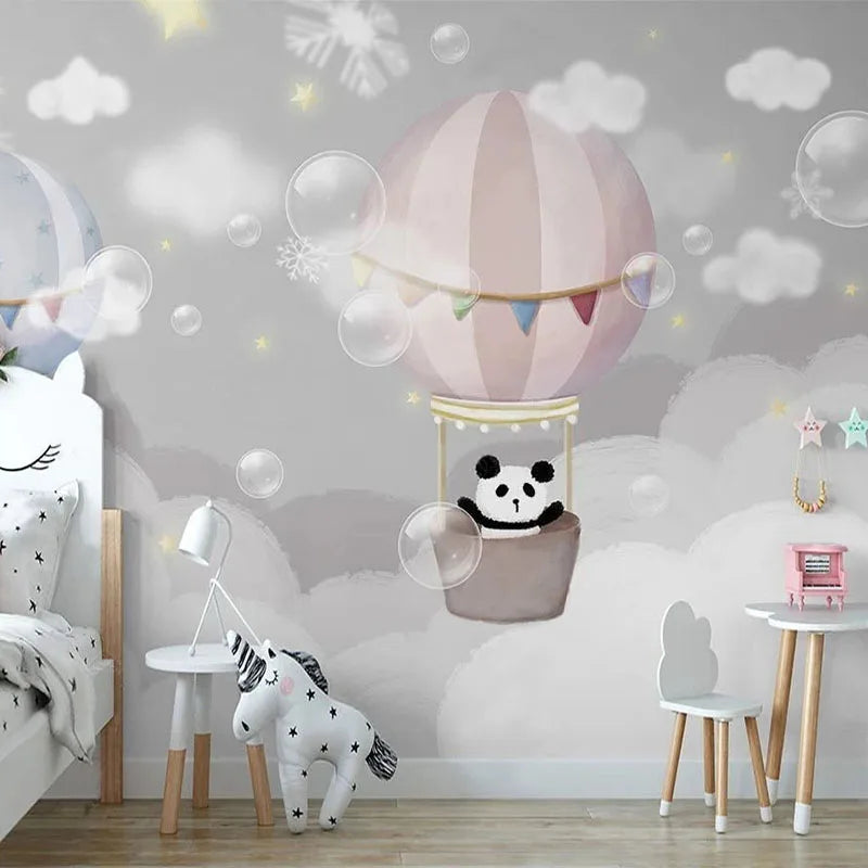 Montgolfière rose et petit panda flottant parmi des nuages et des bulles