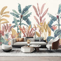 Papier peint panoramique de feuillages tropicaux pastel dans un salon avec canapé blanc